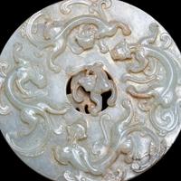A Chinese Pale Celadon Jade 'Chilong' Bi Disk 青玉螭龍紋璧