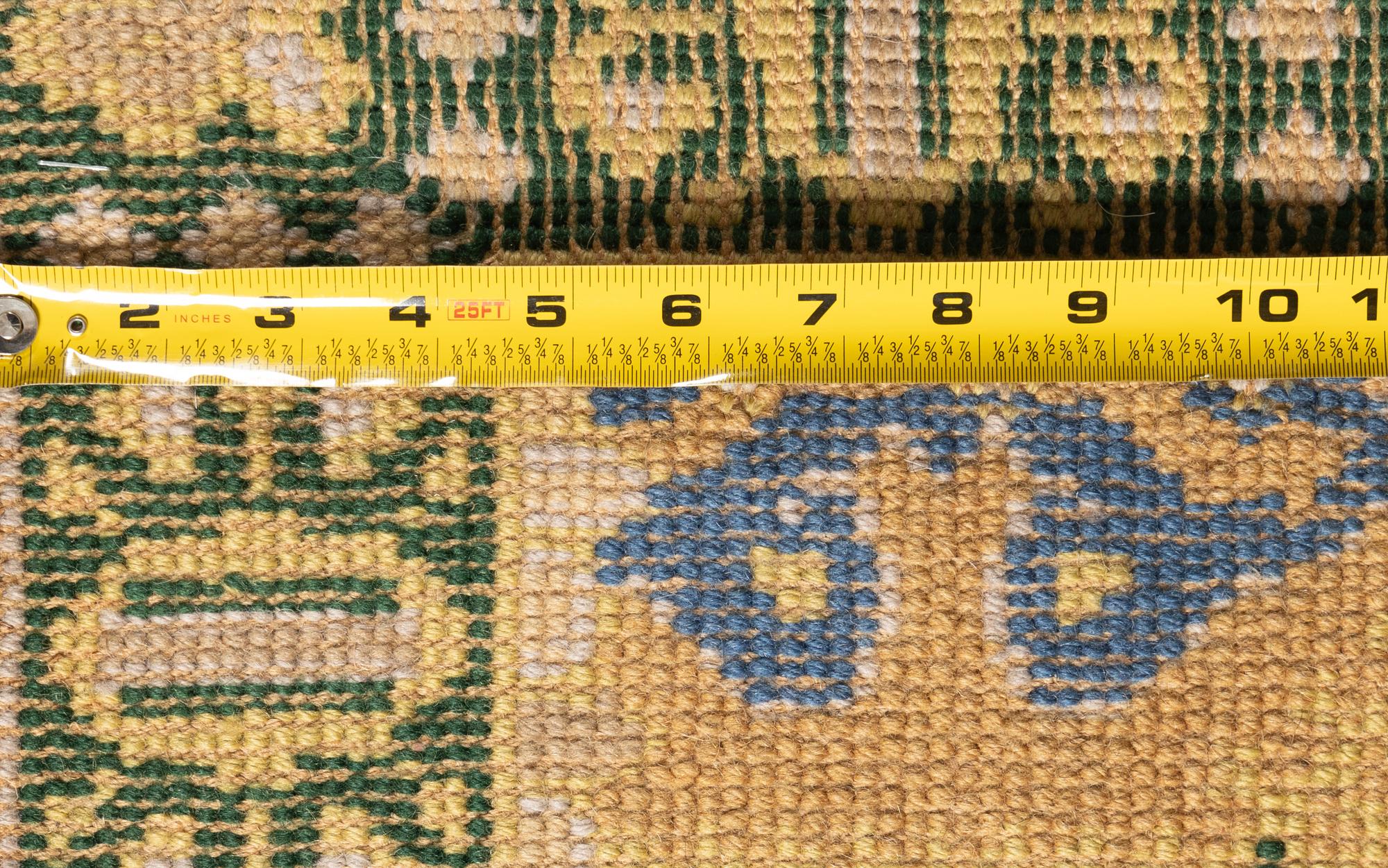A Portuguese Needlepoint Rug