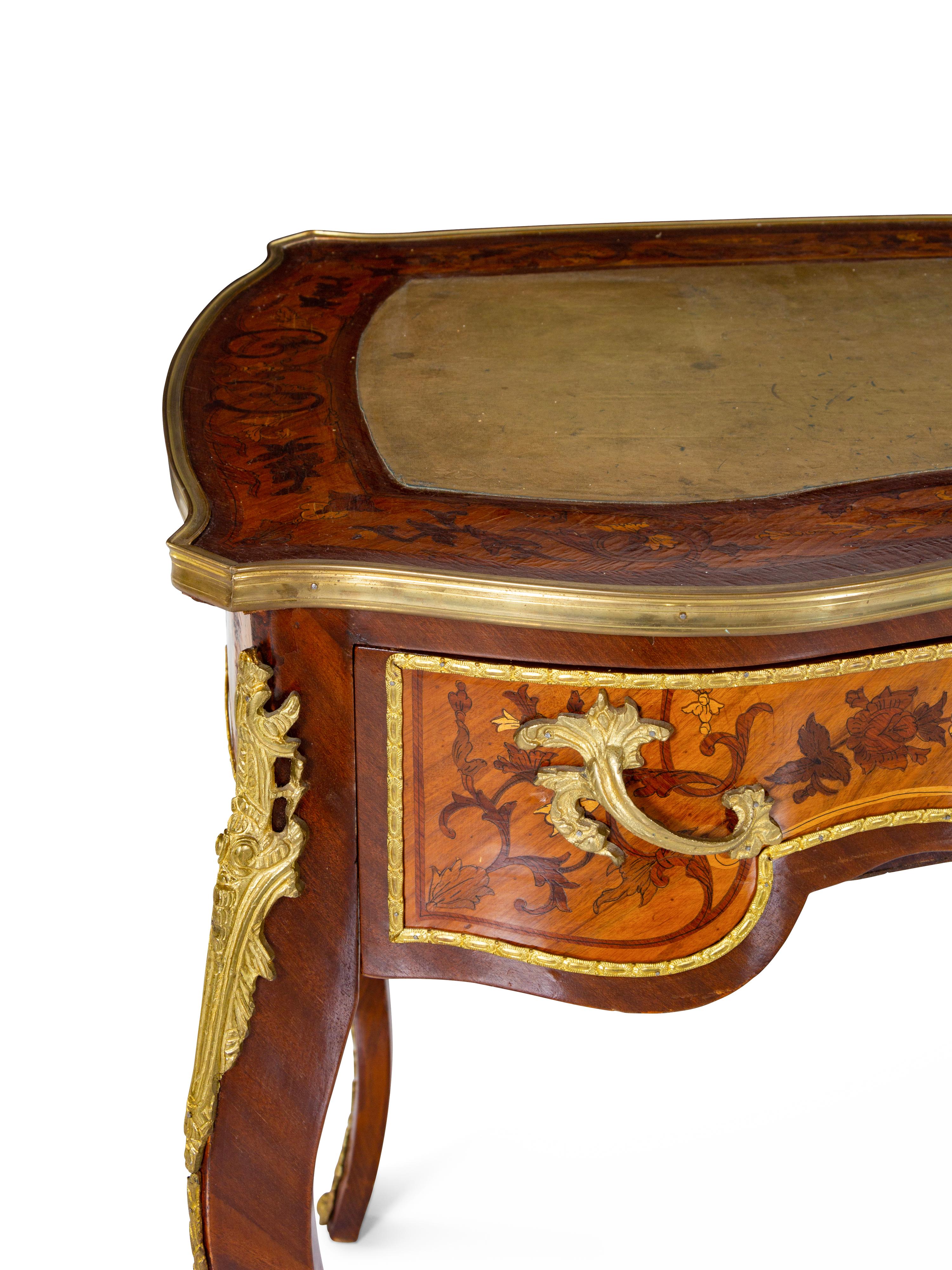 A Louis XV Style Gilt Bronze Mounted Marquetry Bureau Plat