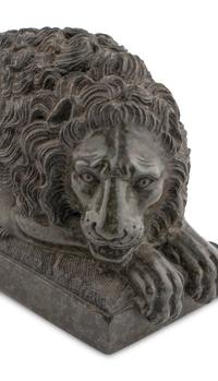 A Pair of Carved Green Marble Recumbent Lions