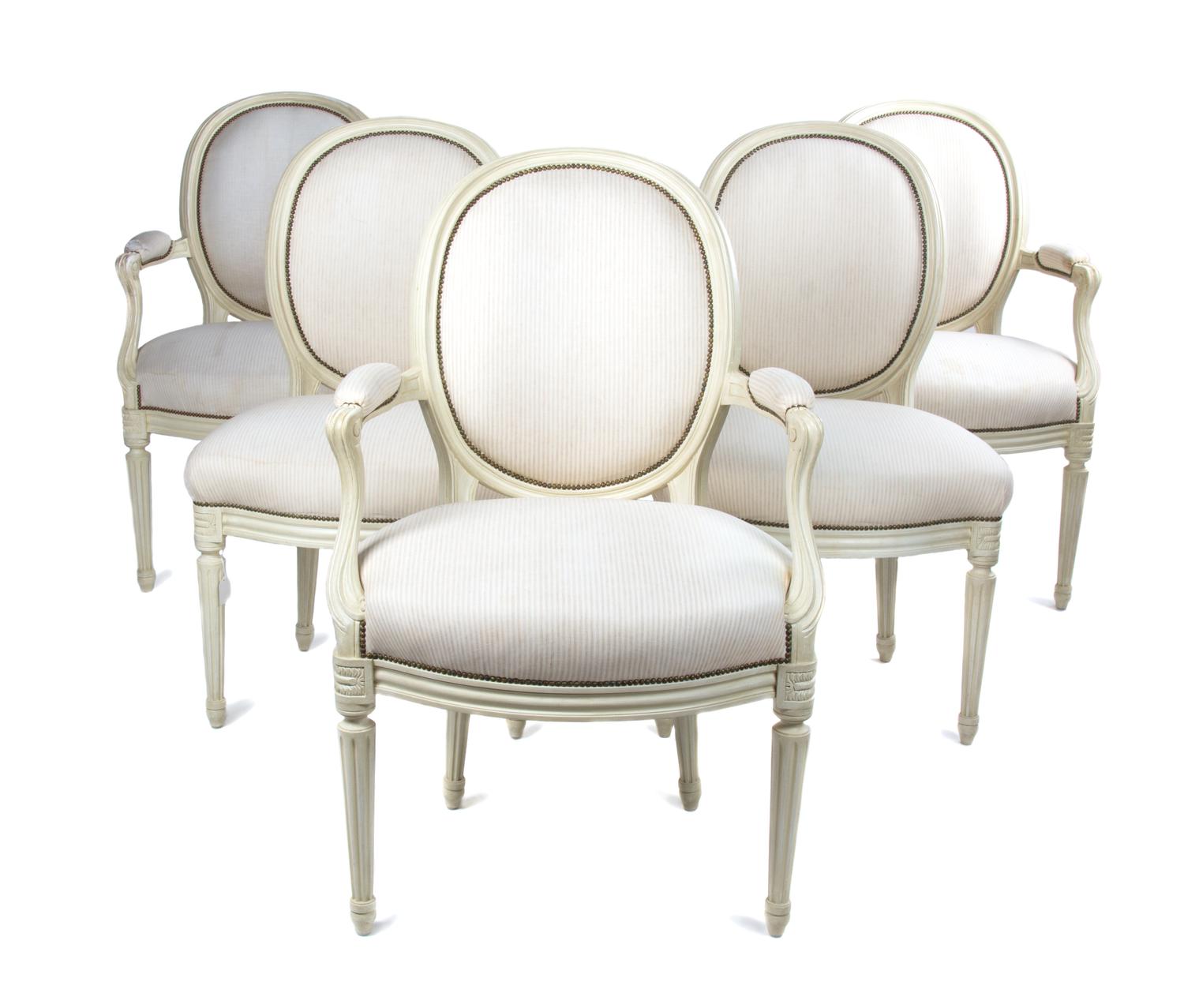 A Set of Five Louis XVI Style Painted Fauteuils Height of first 19 inches. — 20TH CENTURY