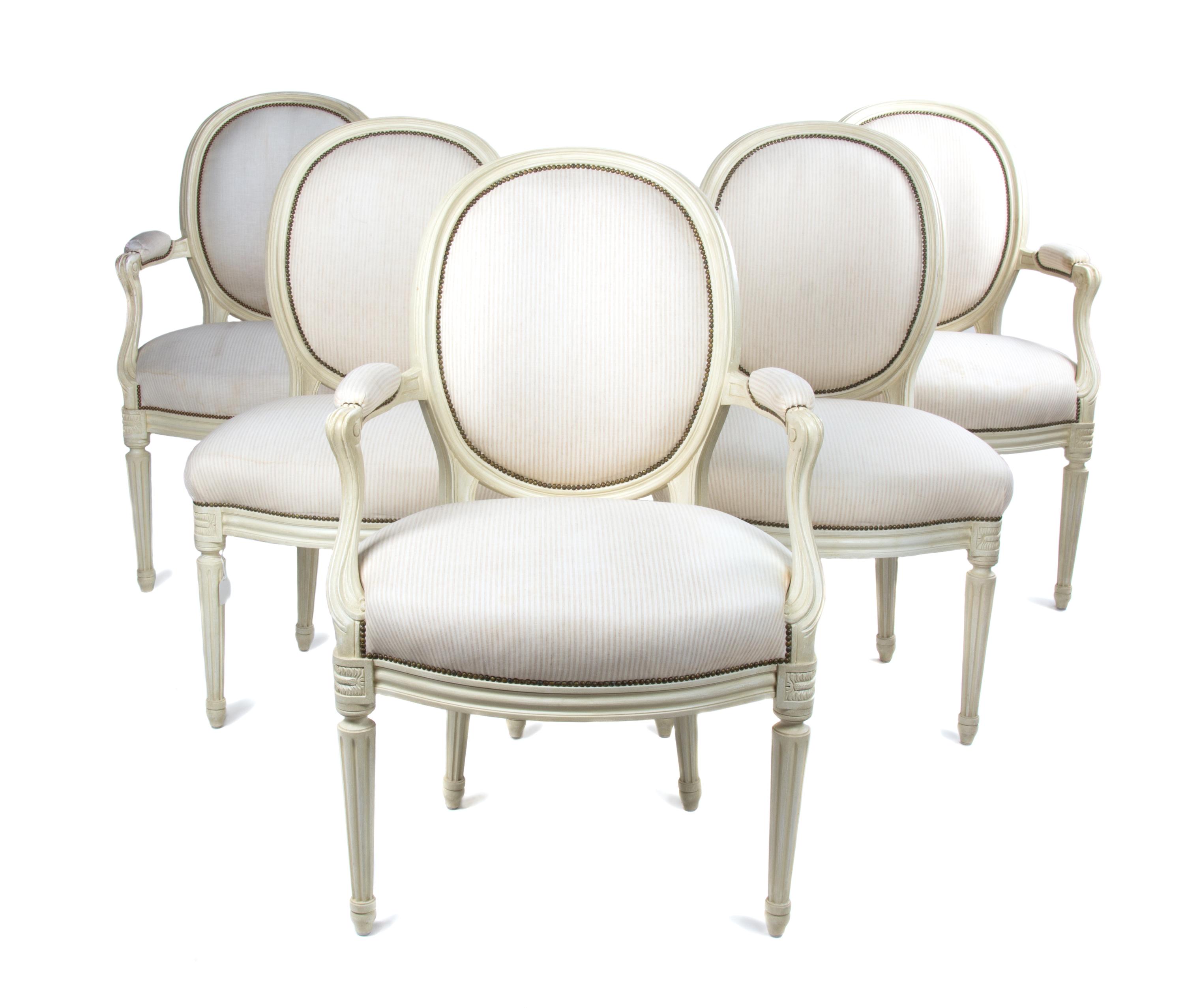 A Set of Five Louis XVI Style Painted Fauteuils Height of first 19 inches. — 20TH CENTURY