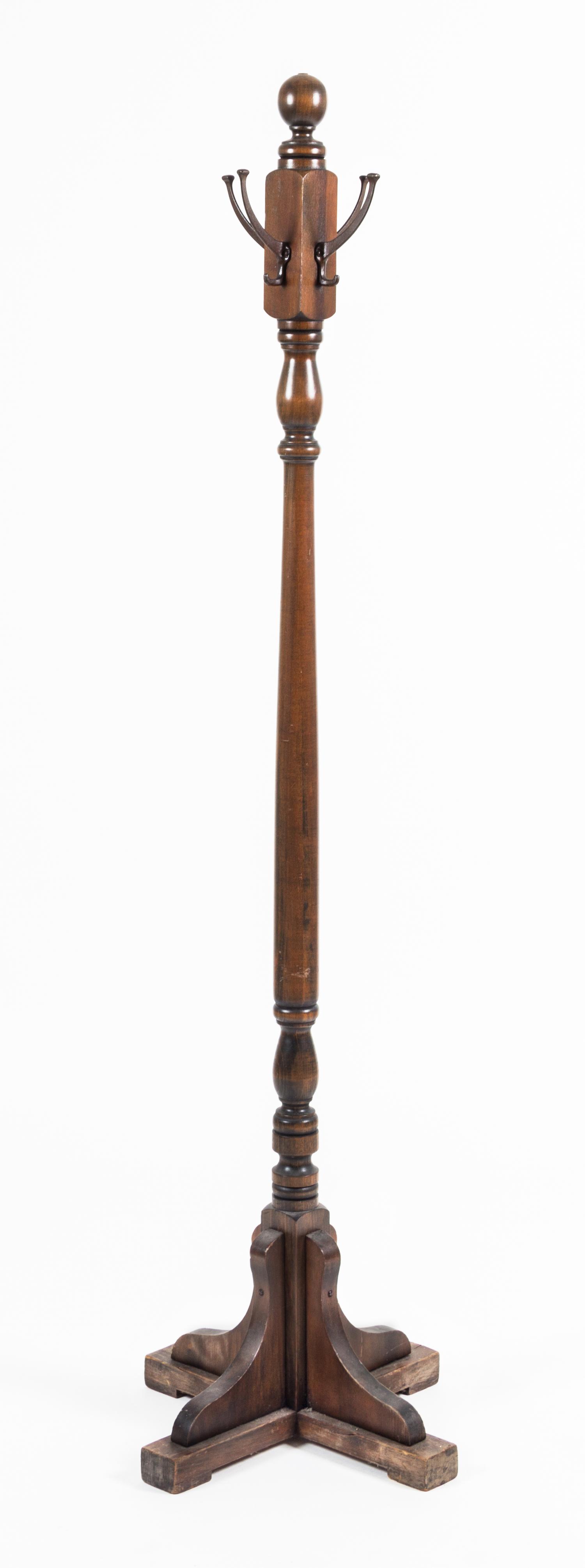 A Mahogany Coat Rack Height 67 1/2 inches.
