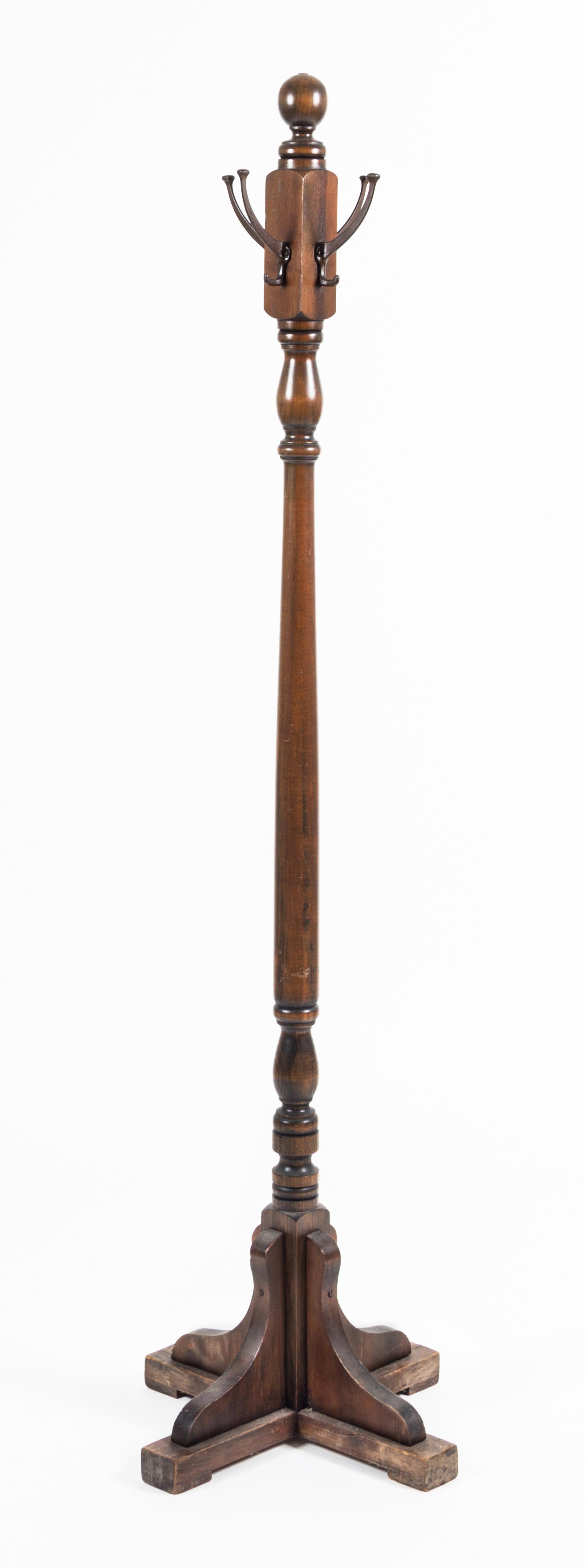 A Mahogany Coat Rack Height 67 1/2 inches.