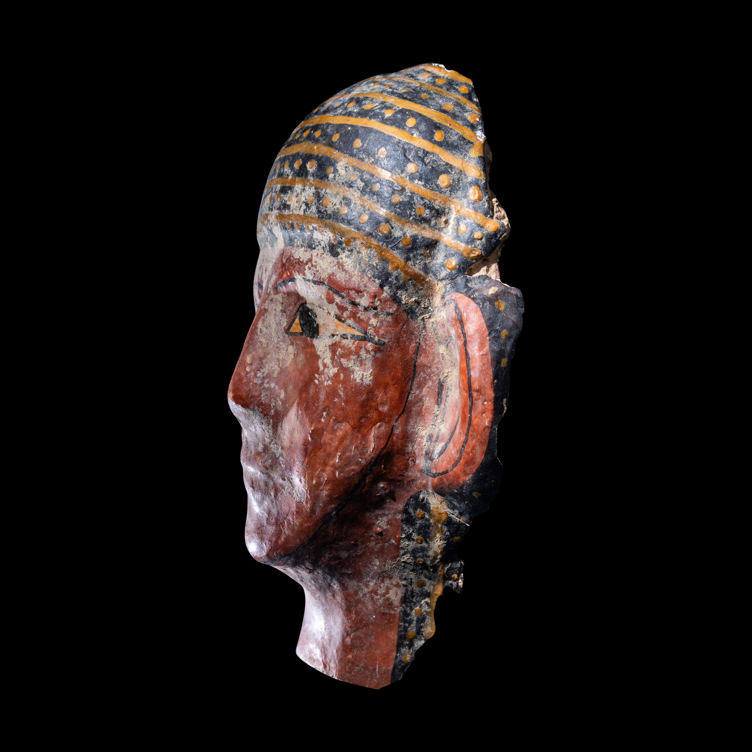 An Egyptian Cartonnage Mummy Mask