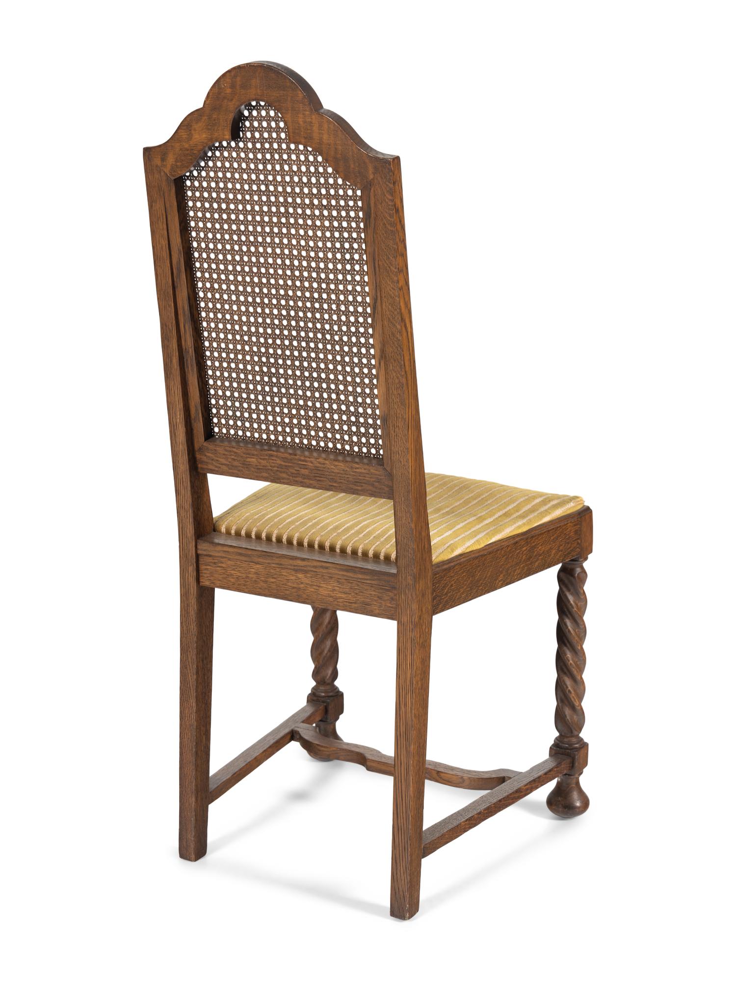 A Set of Eight William and Mary Style Oak Dining Chairs