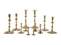 A Group of English and German Brass Candlesticks