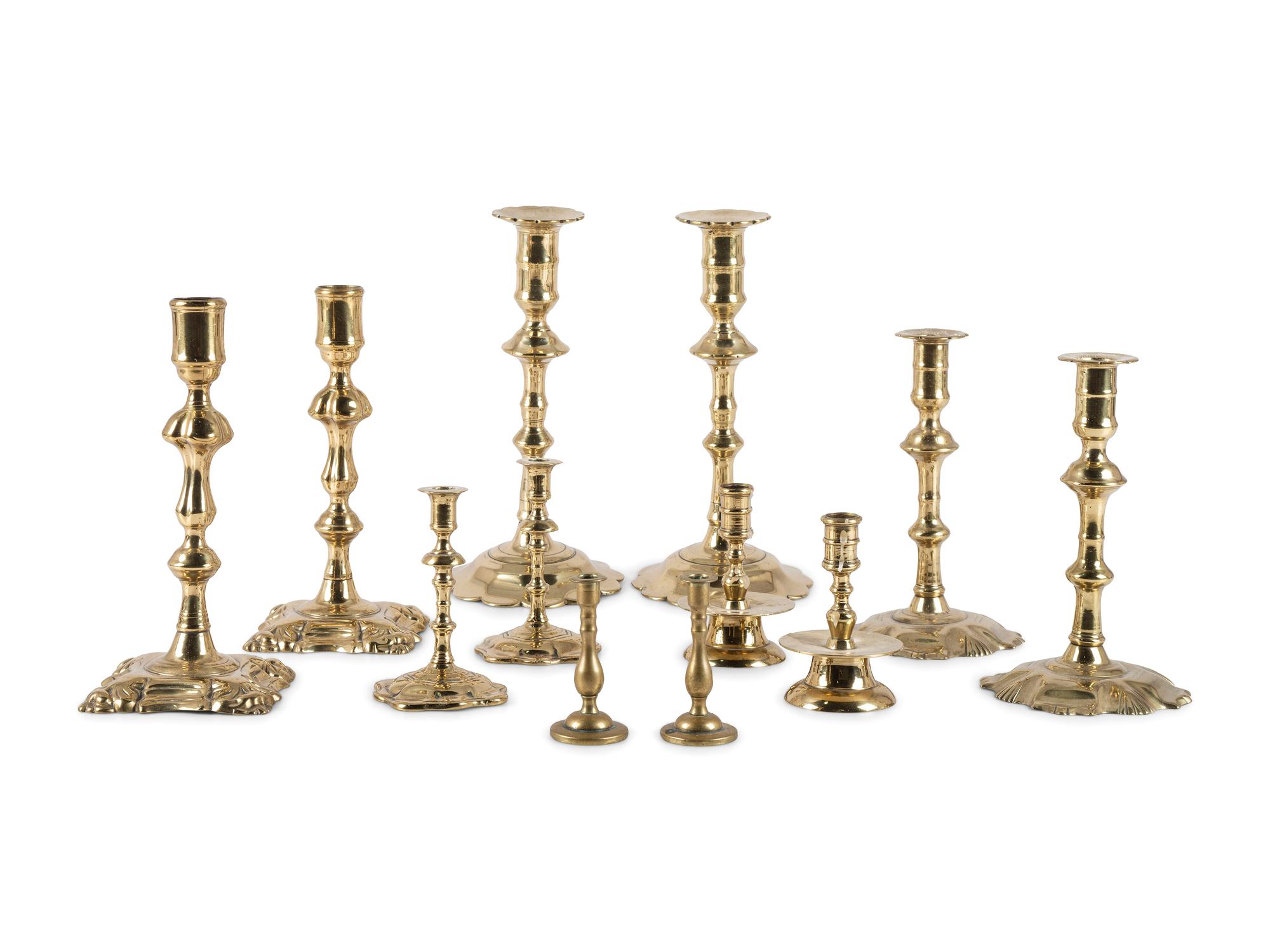 A Group of English and German Brass Candlesticks