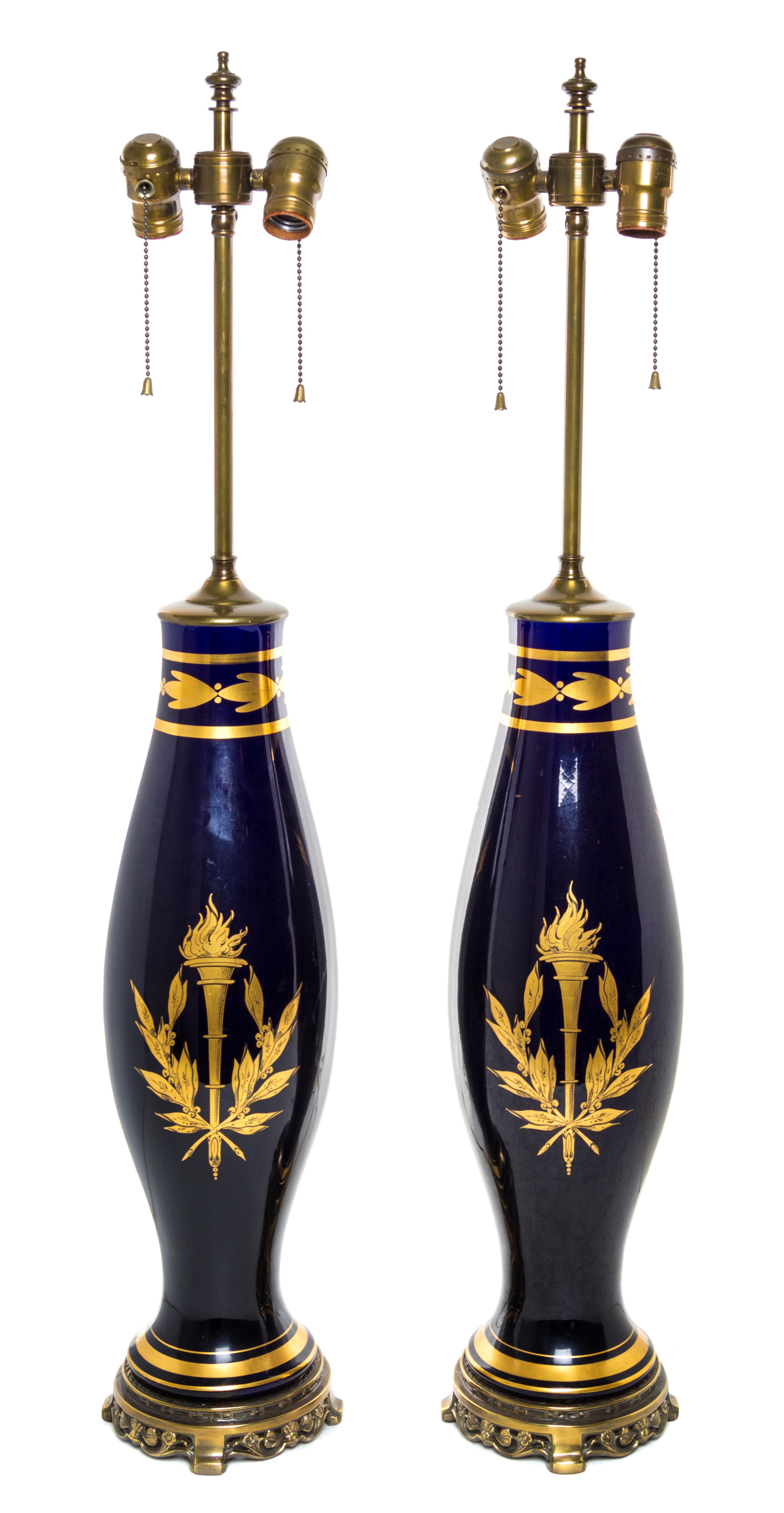 A Pair of French Gilt Metal Mounted Porcelain Lamps Height overall 35 inches.