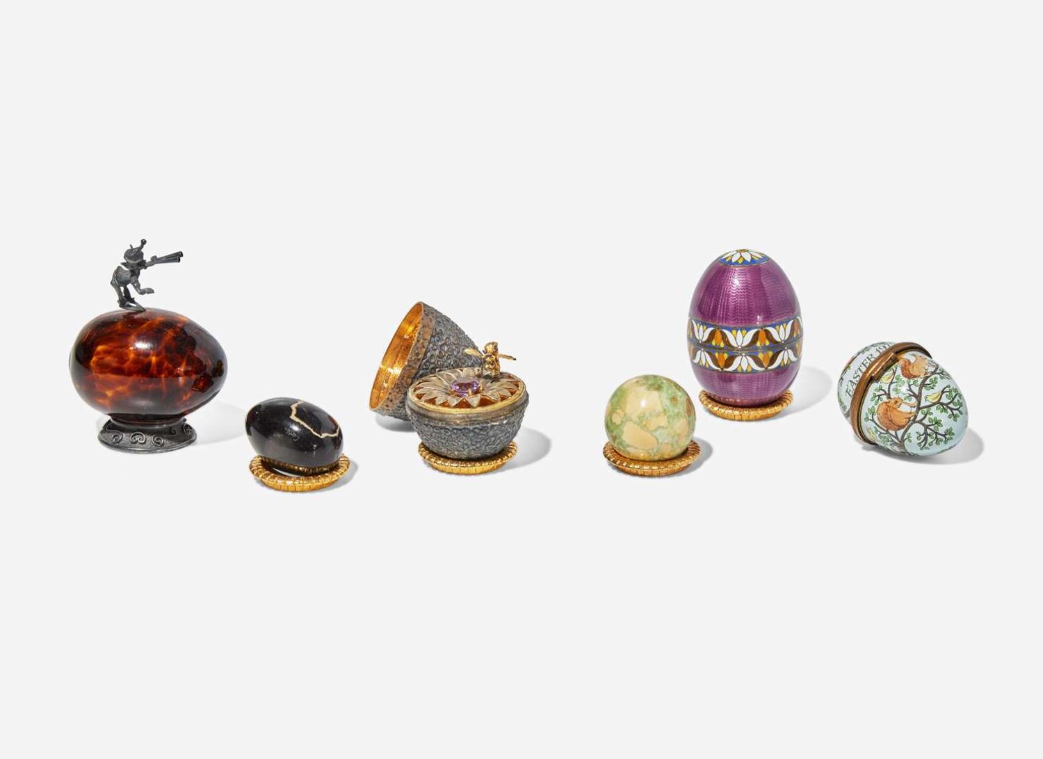 A group of five sterling silver, silver gilt, enamel, and semiprecious eggs, various makers, 20th century