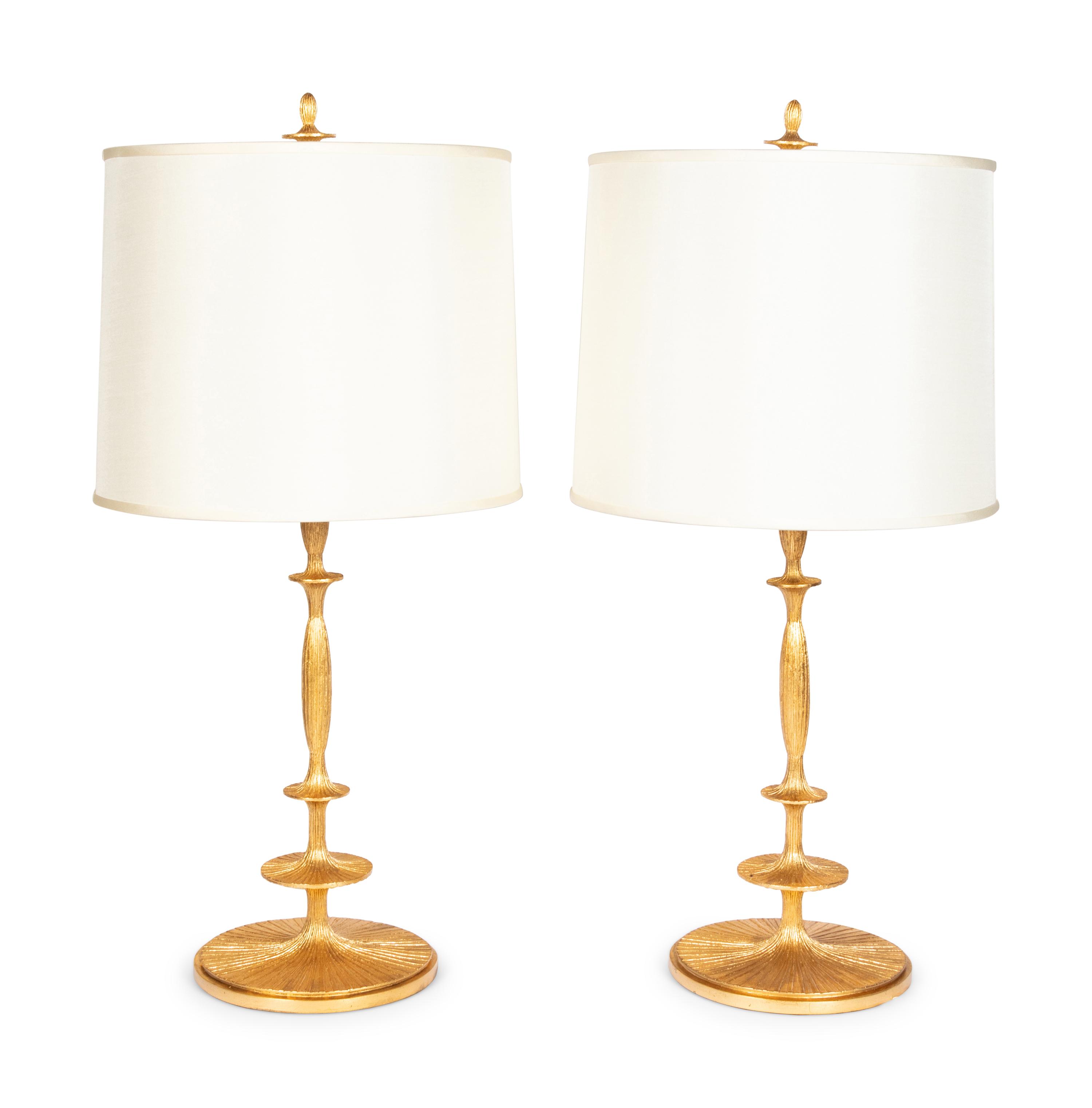A Pair of Gilt Resin Table Lamps with Shades