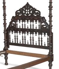 A Gothic Revival Walnut Four Poster Bed