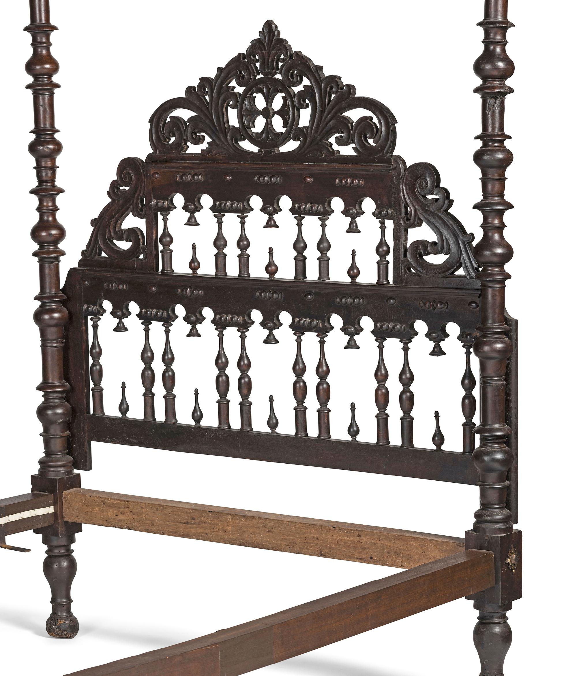 A Gothic Revival Walnut Four Poster Bed