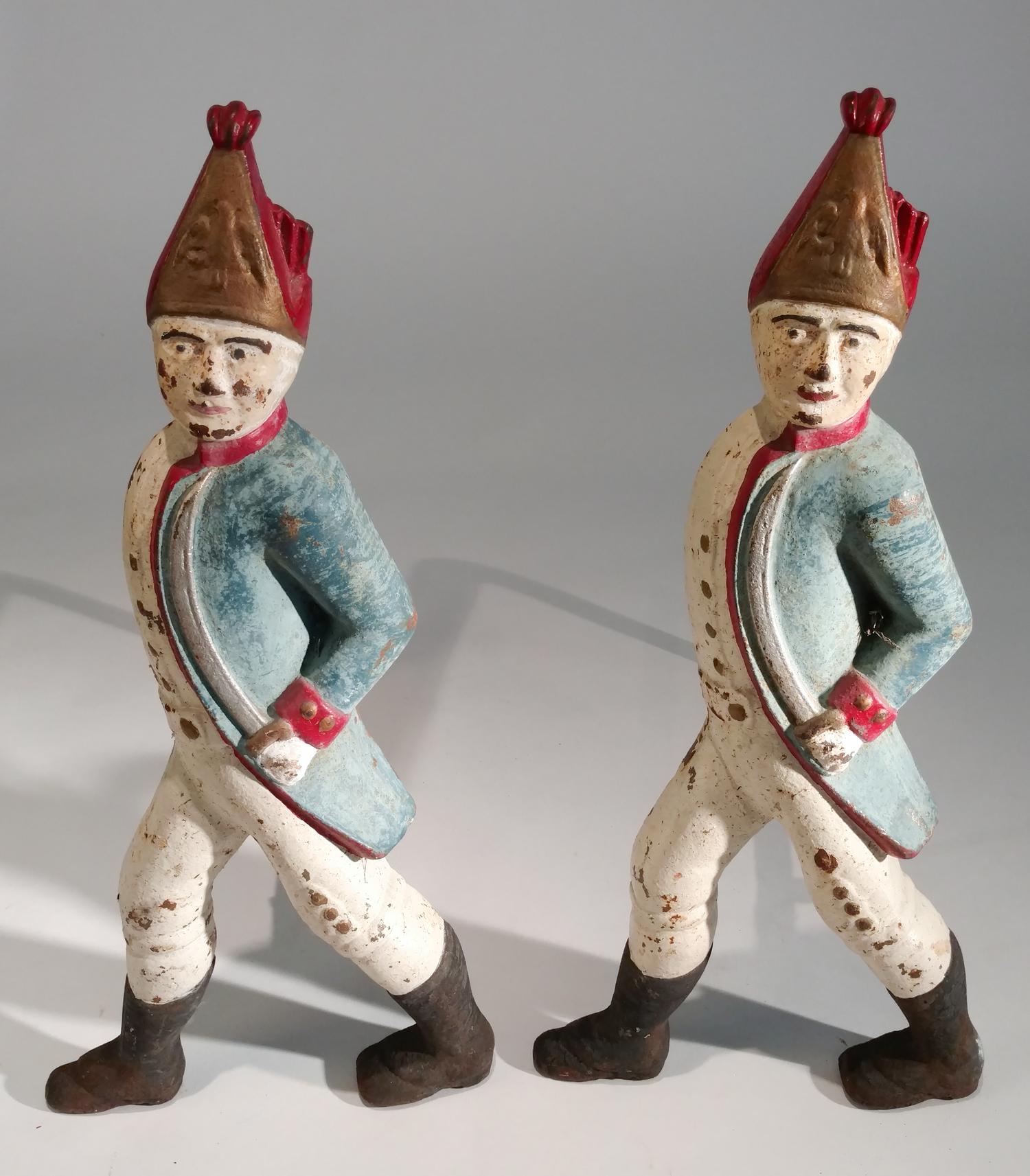 A Pair of Painted Iron Andirons Height 21 inches.