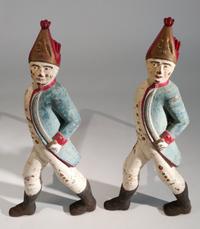 A Pair of Painted Iron Andirons Height 21 inches.