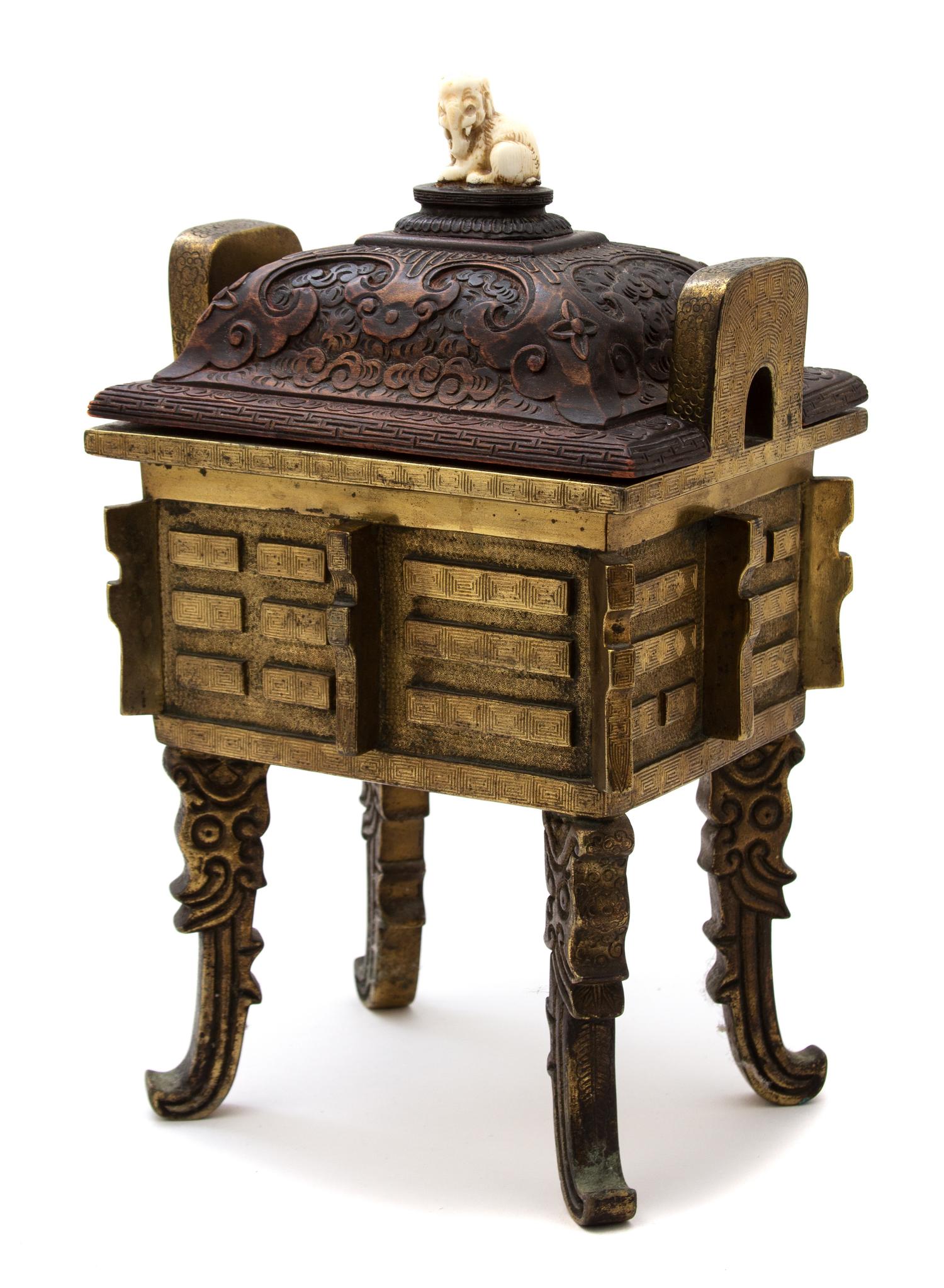 A Chinese Bronze Censer with Carved Wood Lid Height 13 x width 8 x depth 6 1/2 inches. — 19TH CENTURY