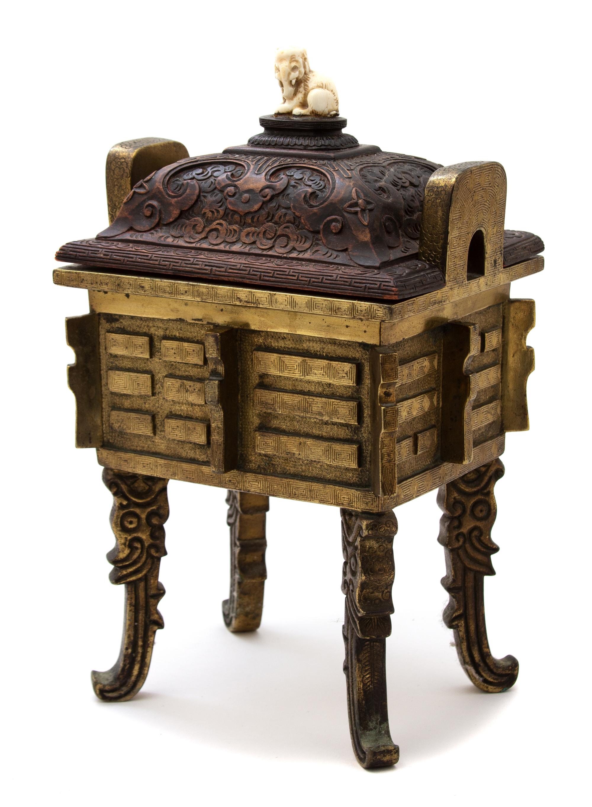 A Chinese Bronze Censer with Carved Wood Lid Height 13 x width 8 x depth 6 1/2 inches. — 19TH CENTURY