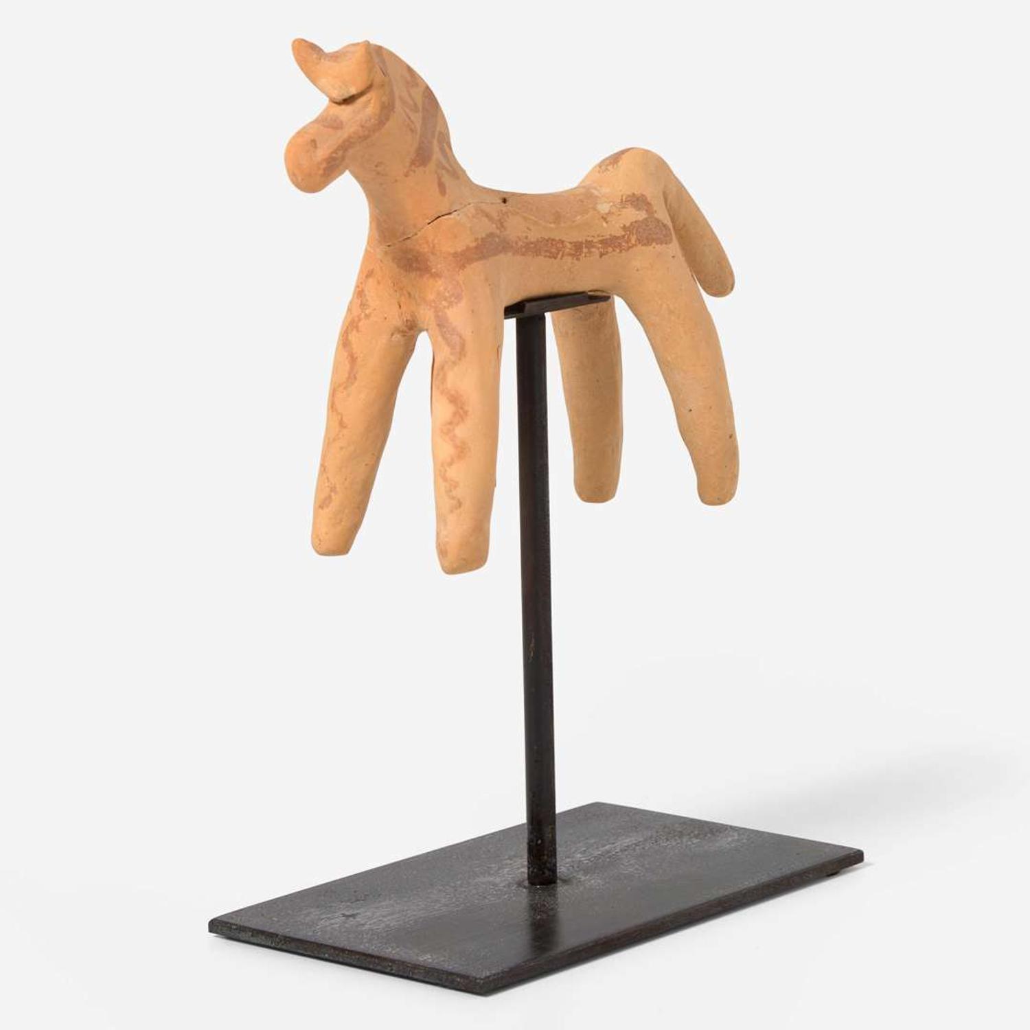 A Boeotian terracotta figure of a horse circa 6th century B.C.