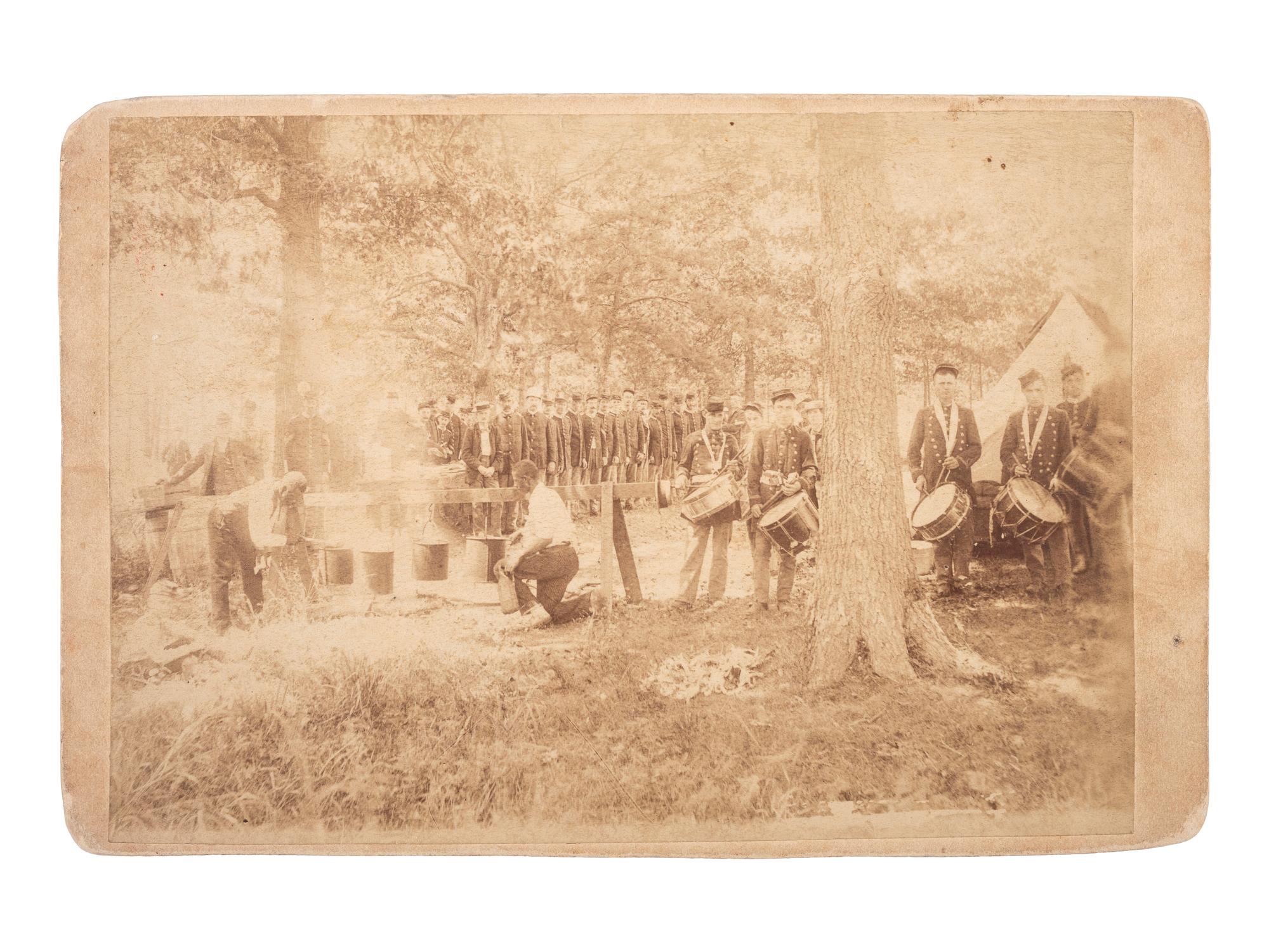 [AFRICAN AMERICANA] -- [CIVIL WAR]. Cabinet card featuring two African American cooks at camp with Union soldiers and drummer boys.