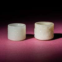 Two Chinese White Jade Carved and Inscribed Archer's Rings, 18th/19th Century — 清中期 白玉扳指兩枚
