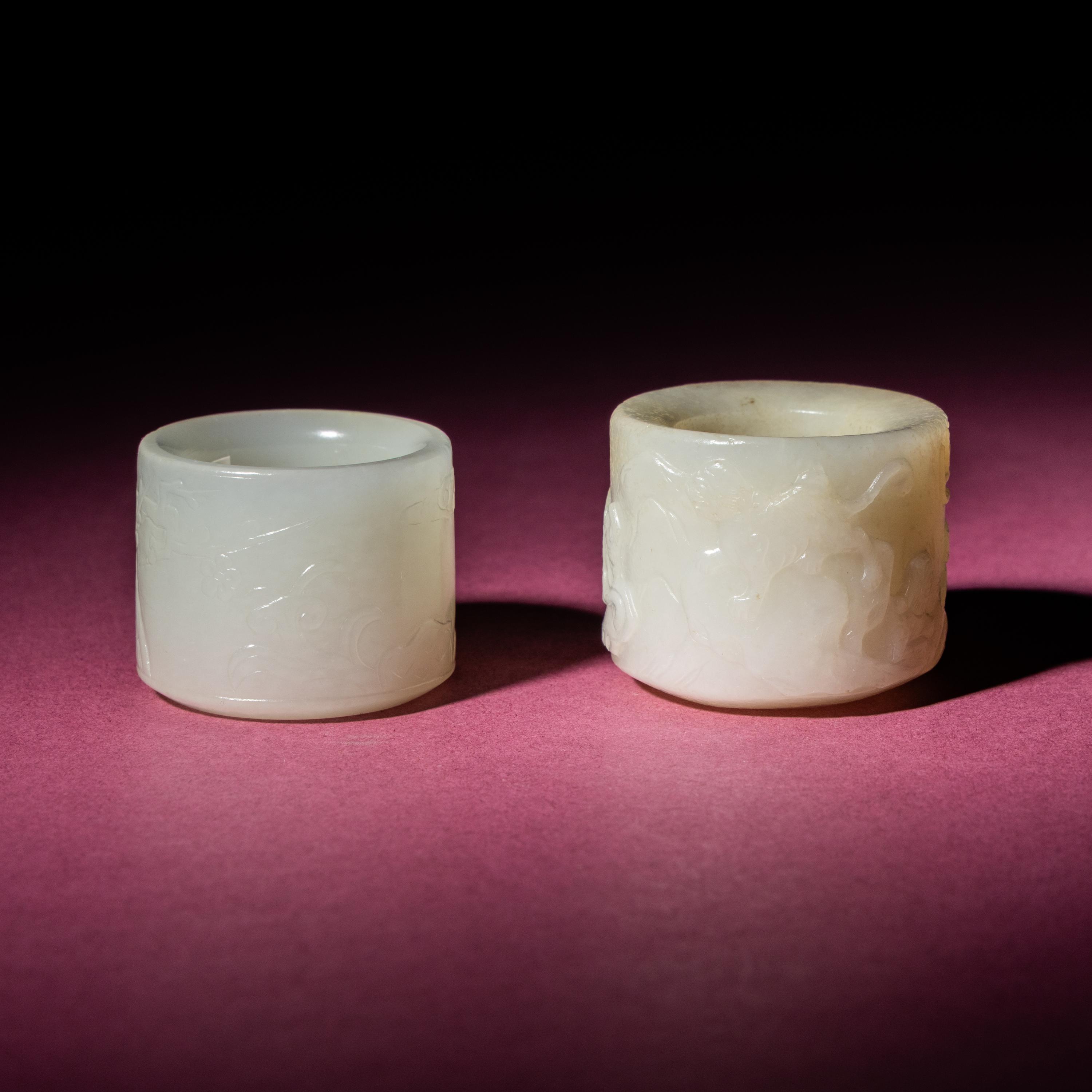 Two Chinese White Jade Carved and Inscribed Archer's Rings, 18th/19th Century — 清中期 白玉扳指兩枚