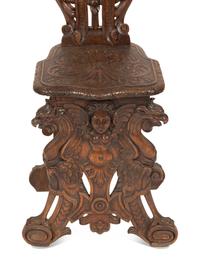 An Italian Renaissance Revival Carved Walnut Sgabello Hall Chair