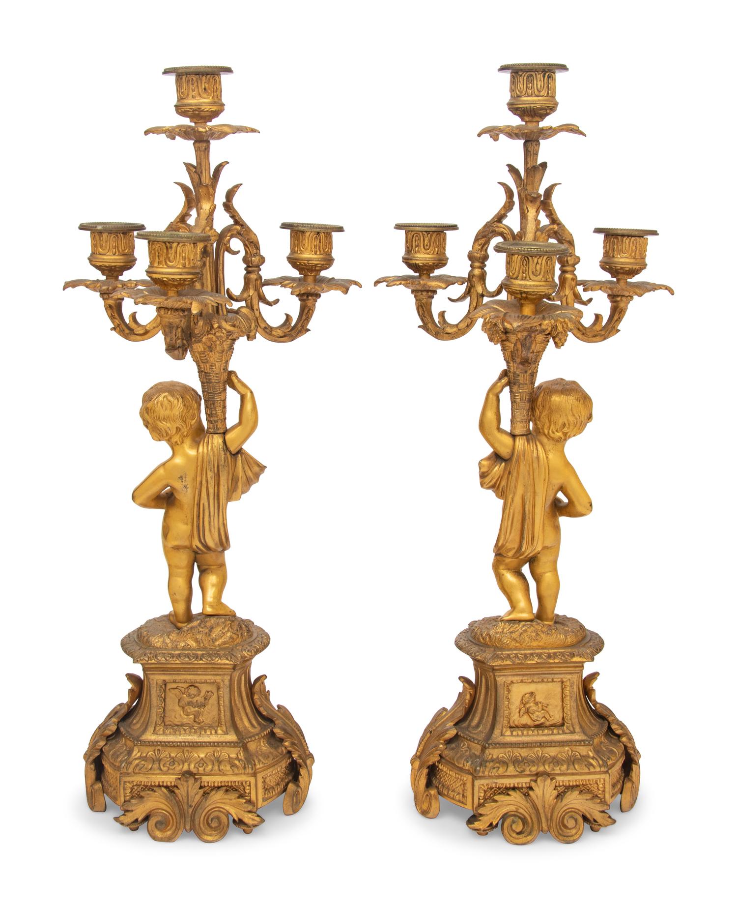 A Pair of French Gilt Bronze and Porcelain Inset Four-Light Candelabra