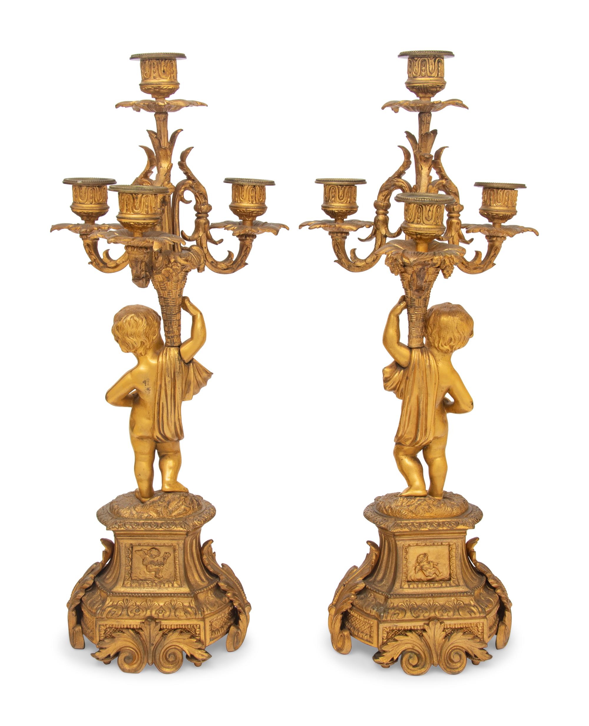 A Pair of French Gilt Bronze and Porcelain Inset Four-Light Candelabra