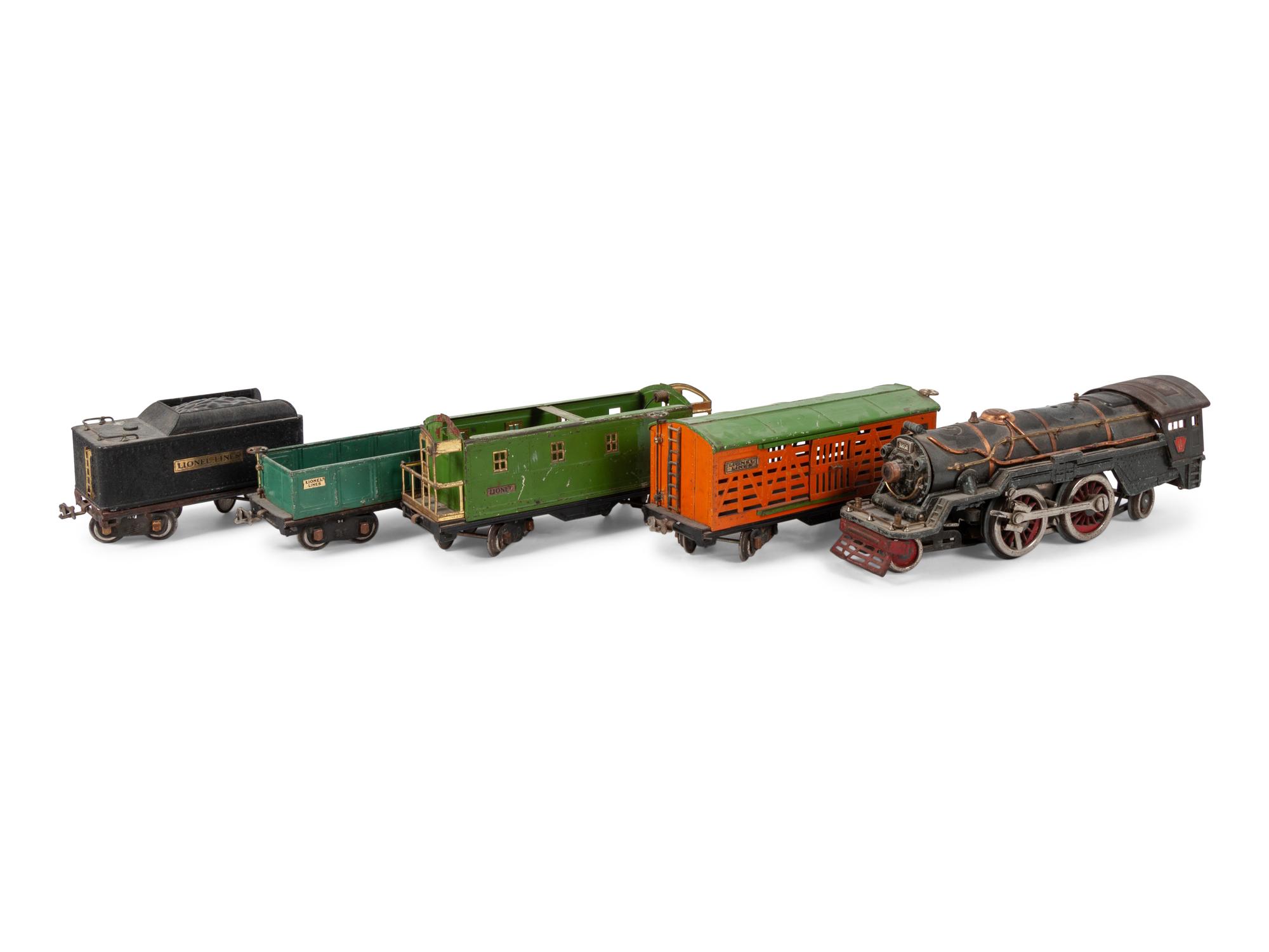 A Lionel 385E Loco Engine and Tender, Three Lionel Train Cars, Four American Flyer Line Cars and Other Accessories