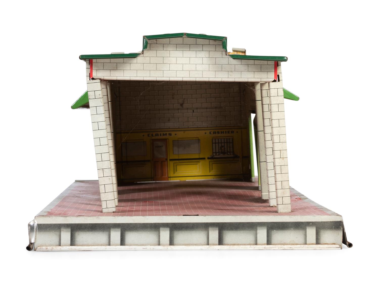 A Group of Toy Service Stations and Cars