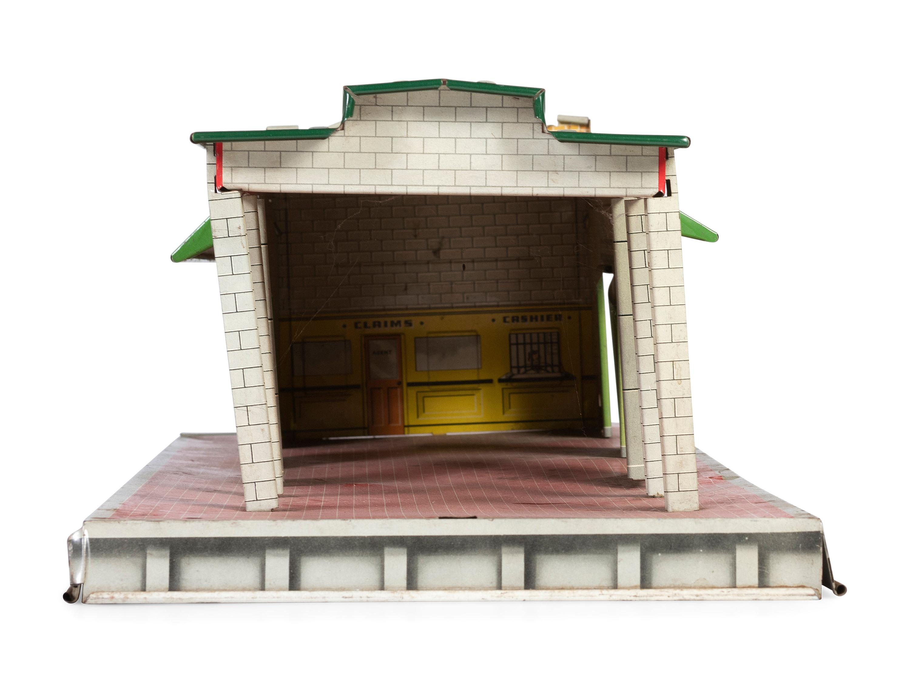 A Group of Toy Service Stations and Cars