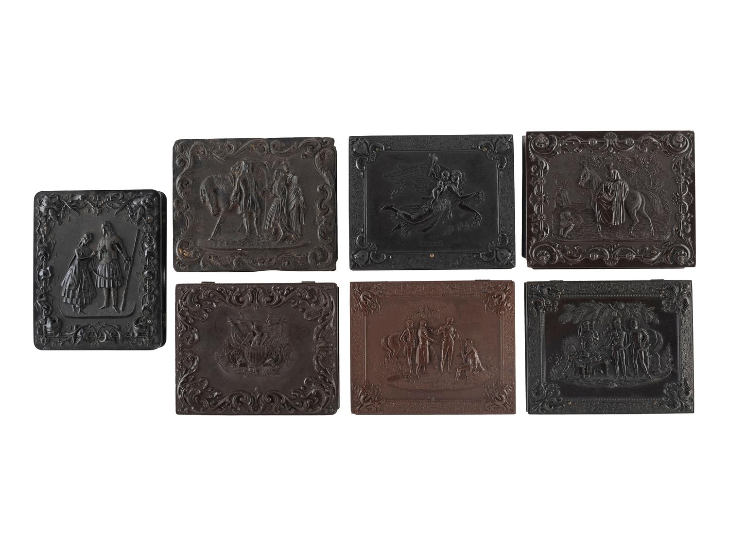 [EARLY PHOTOGRAPHY]. A group of 7 quarter plate Union cases with figural designs, comprising: