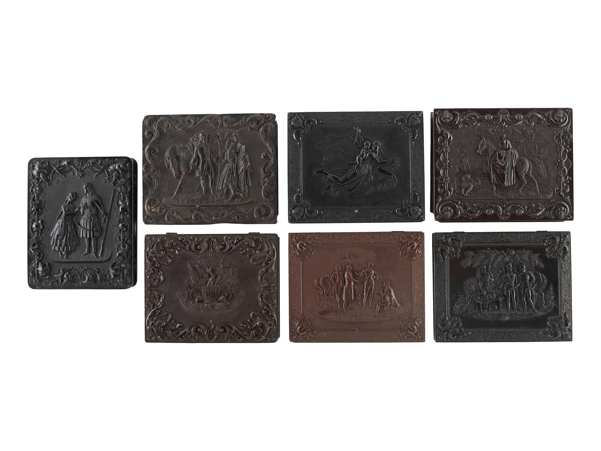 [EARLY PHOTOGRAPHY]. A group of 7 quarter plate Union cases with figural designs, comprising: