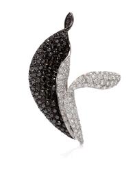An 18 Karat White Gold, Black Diamond and Diamond Pendant/Brooch, 9.70 dwts.