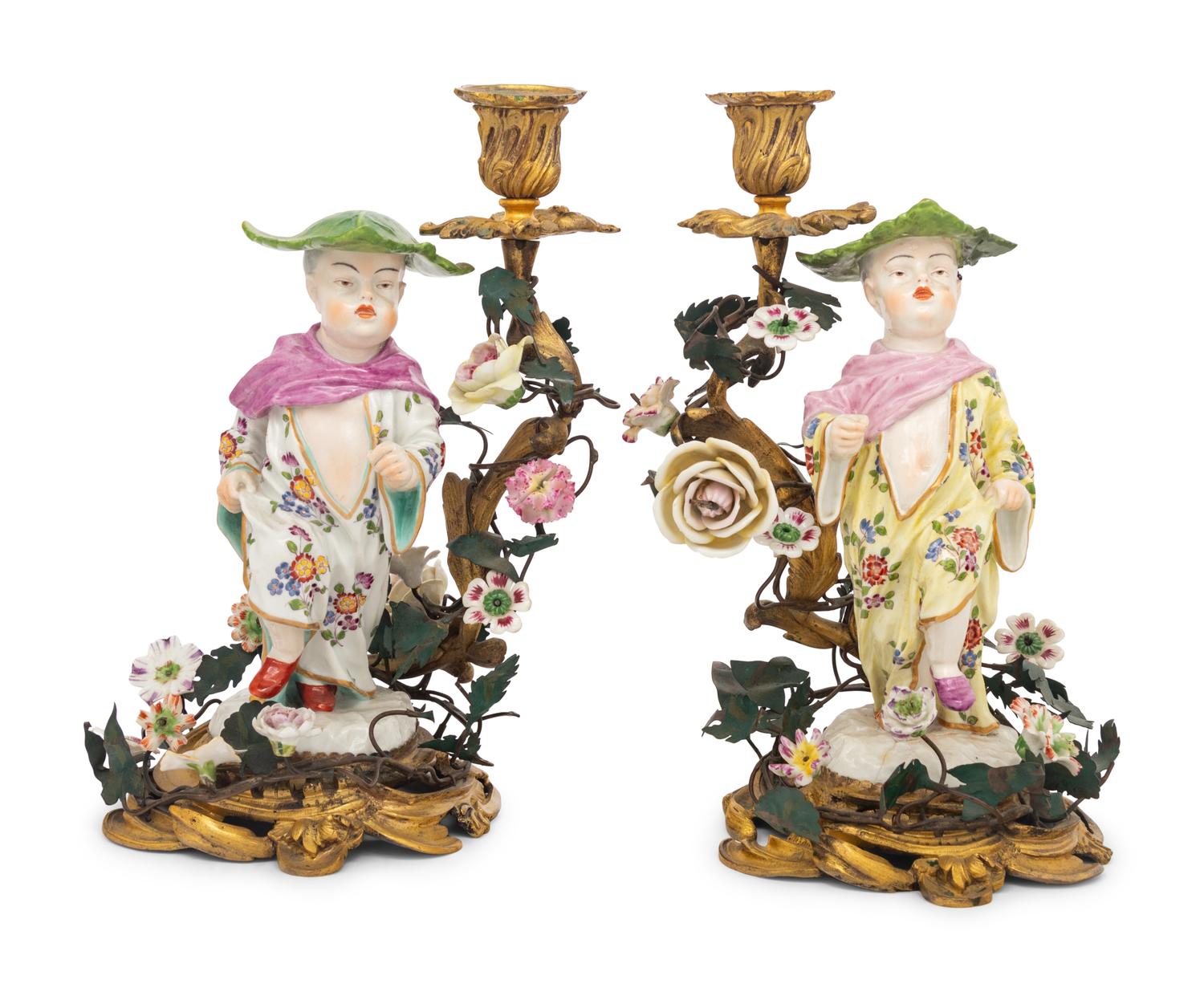 A Pair of French Porcelain, Tôle, and Gilt Bronze Figural Candlesticks