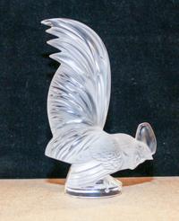 A Lalique Molded and Frosted Glass Mascot Height 8 1/4 inches.