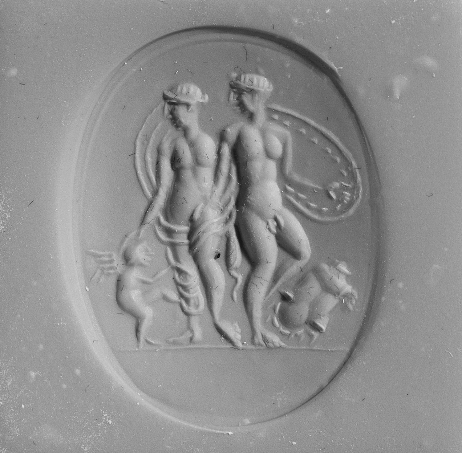 A Roman Carnelian Ring Stone with the Gods Mars, Venus, and Eros