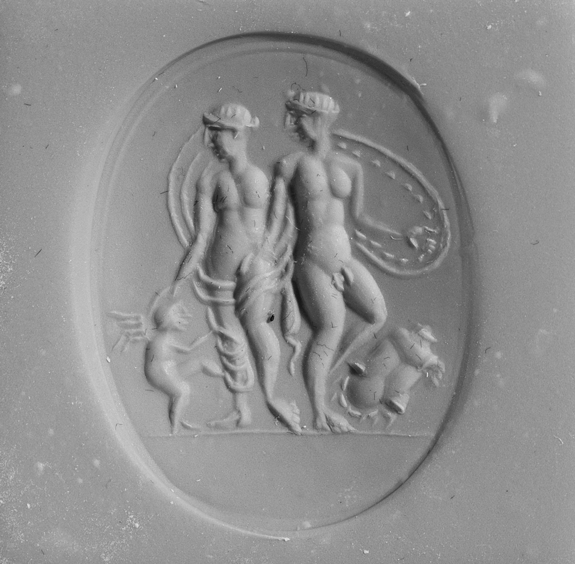 A Roman Carnelian Ring Stone with the Gods Mars, Venus, and Eros