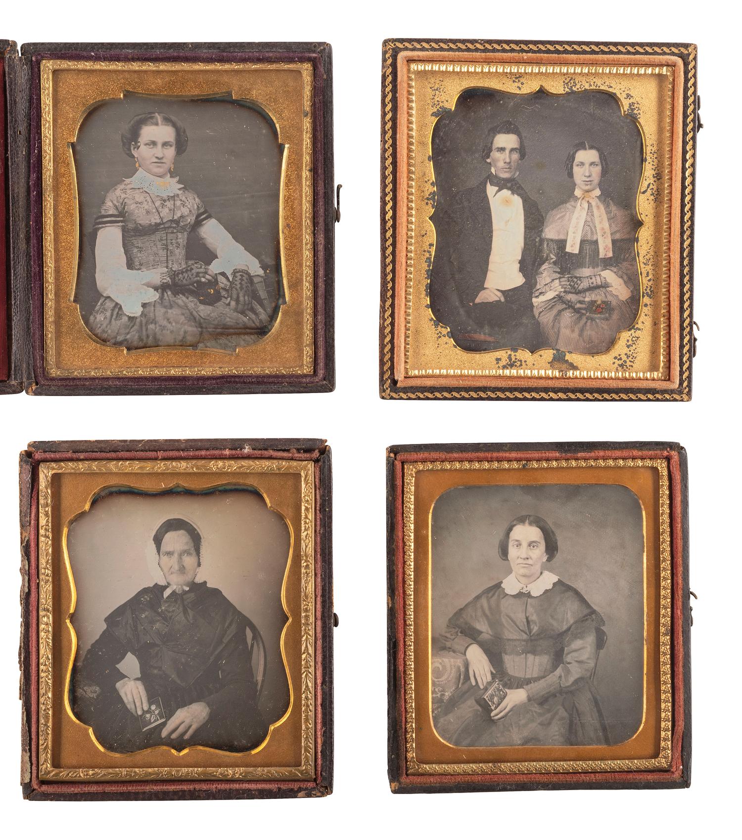 [EARLY PHOTOGRAPHY]. A group of 23 daguerreotypes featuring subjects posed with cased images, including: