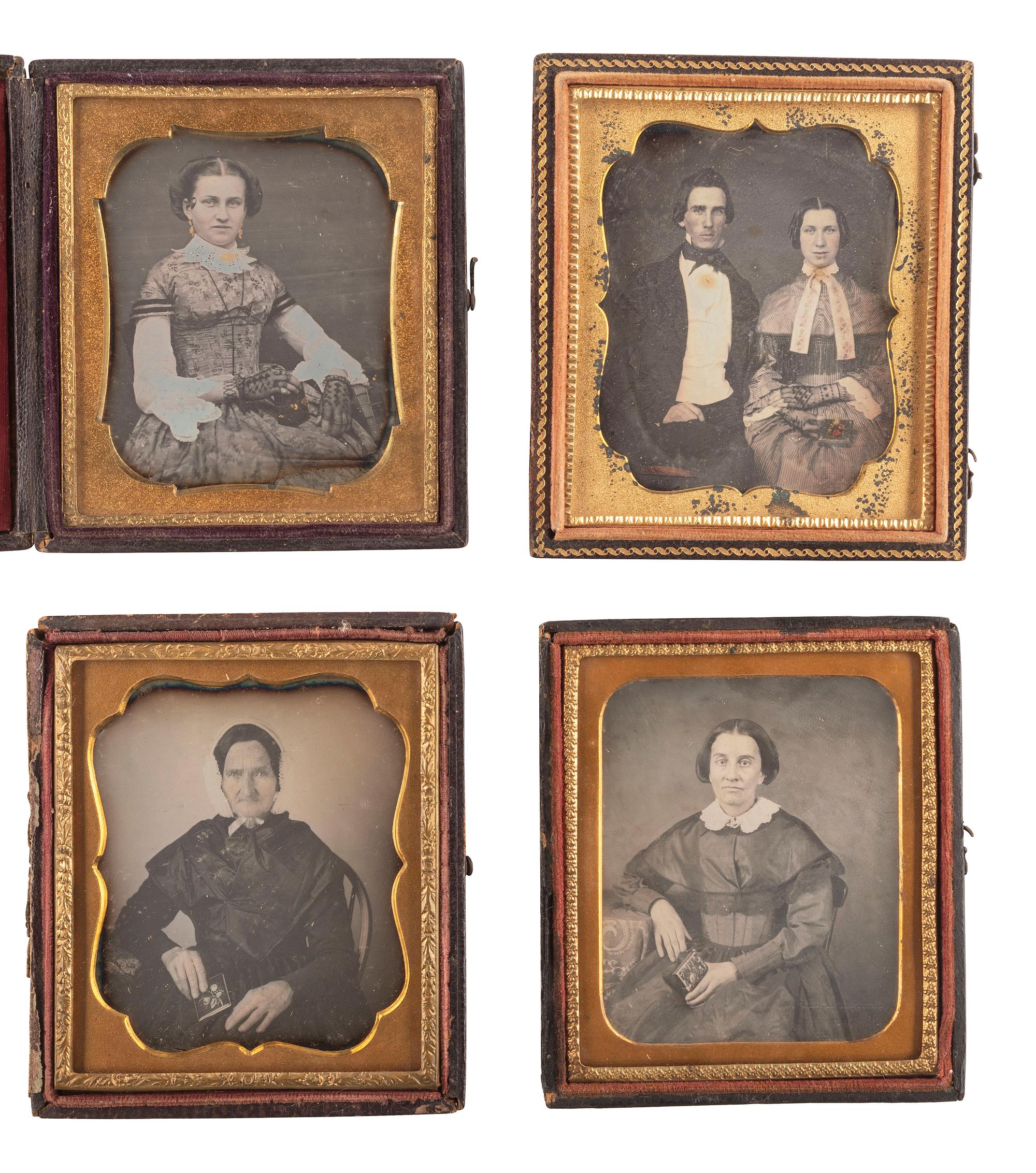 [EARLY PHOTOGRAPHY]. A group of 23 daguerreotypes featuring subjects posed with cased images, including: