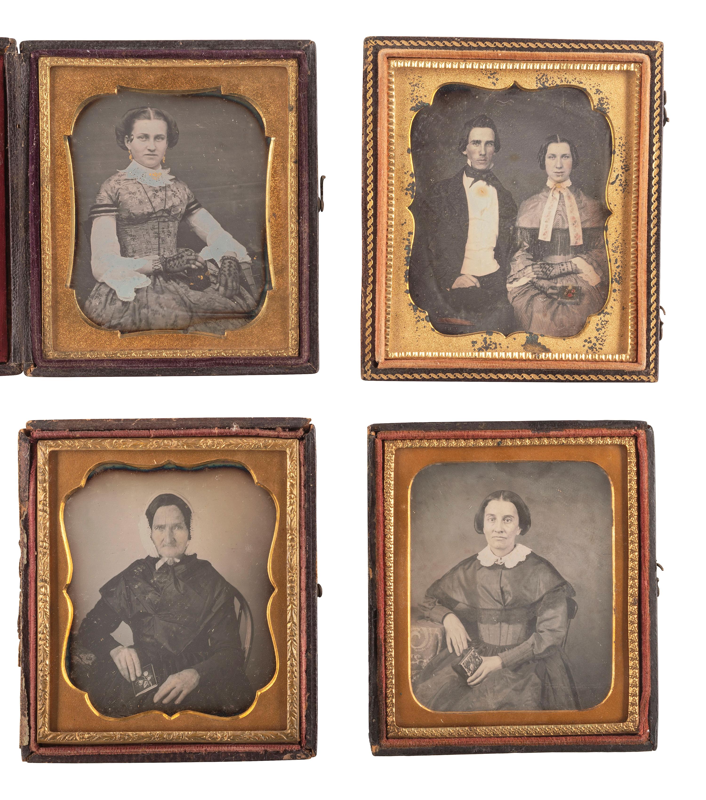 [EARLY PHOTOGRAPHY]. A group of 23 daguerreotypes featuring subjects posed with cased images, including: