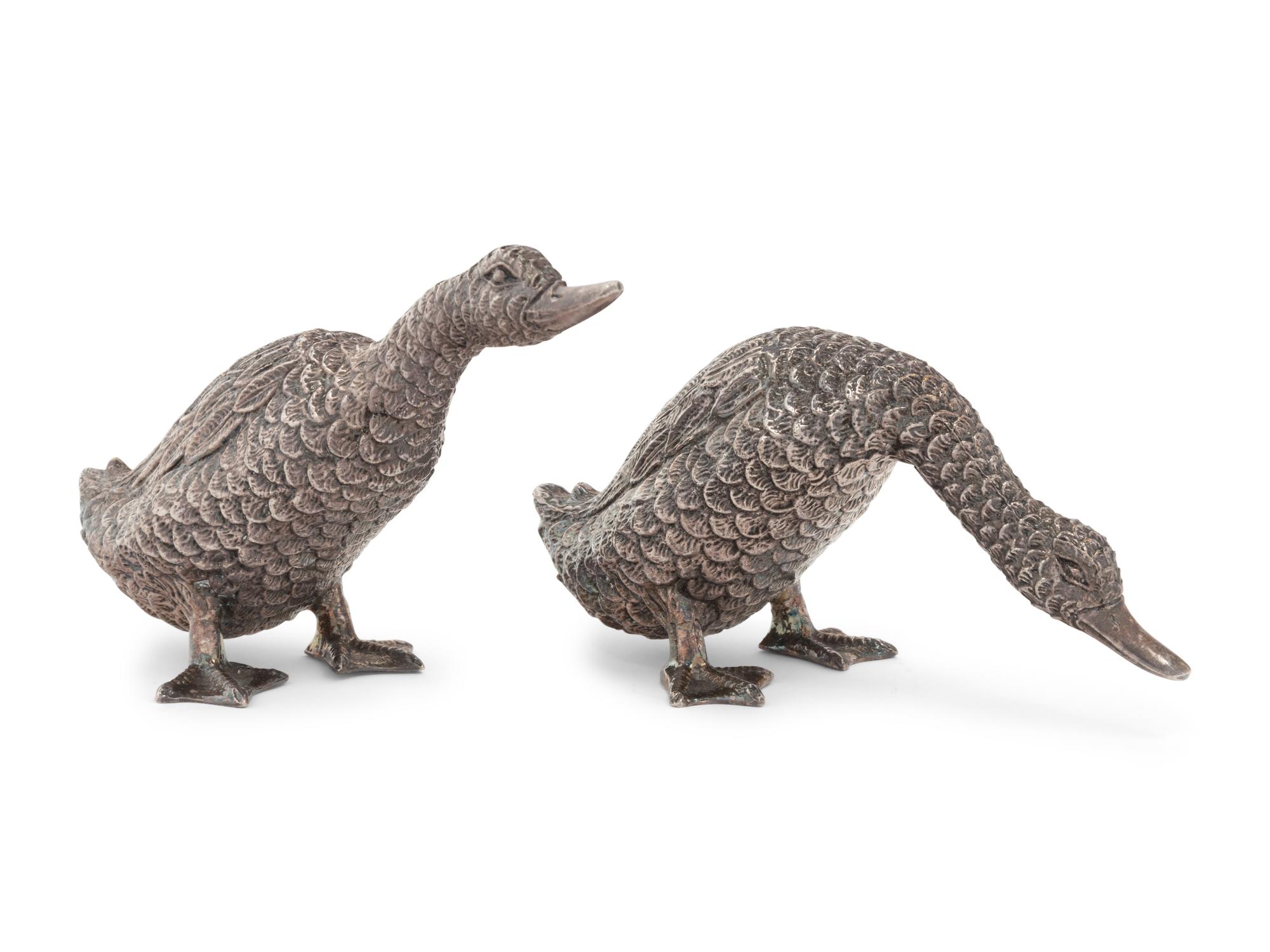 Two Silver Duck Figures
