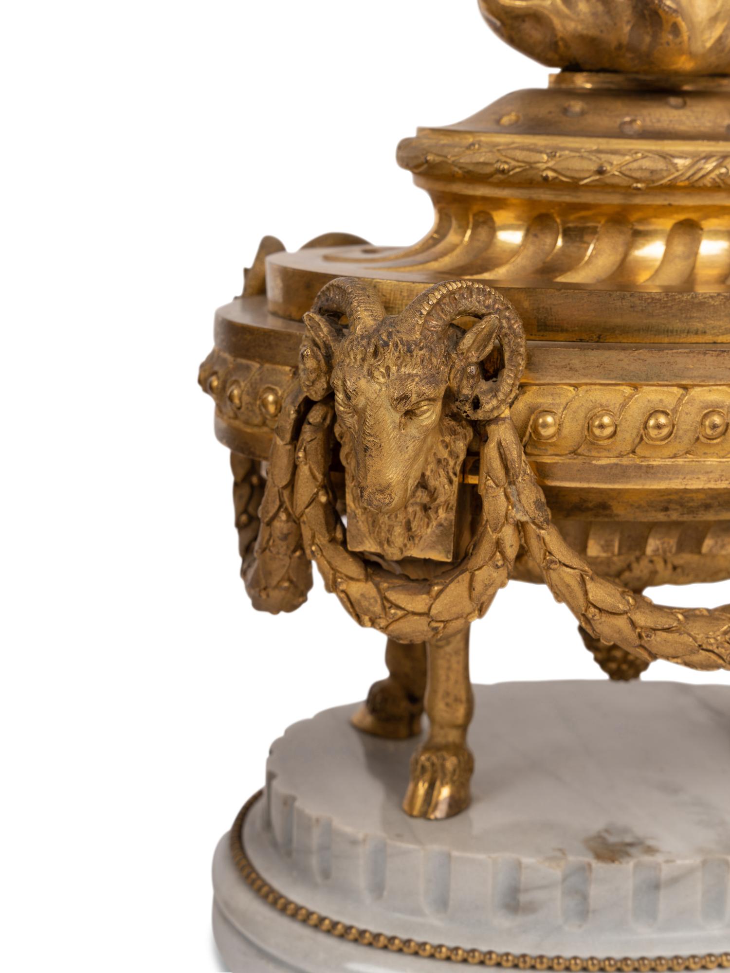 A Pair of French Neoclassical Gilt Bronze and Marble 'Flaming Urn' Ornaments