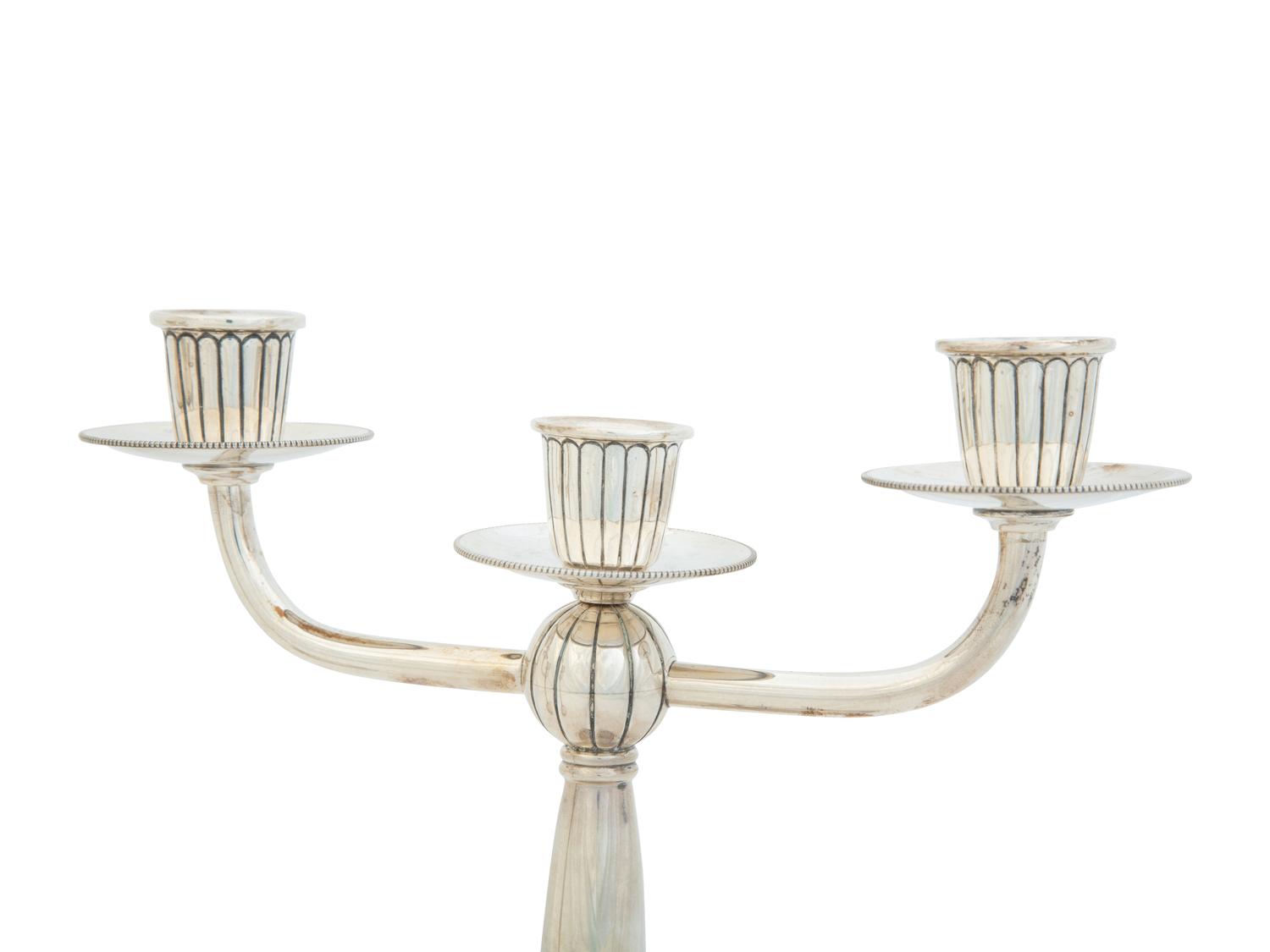 A Pair of Argentine Weighted Silver Three-Light Candelabra