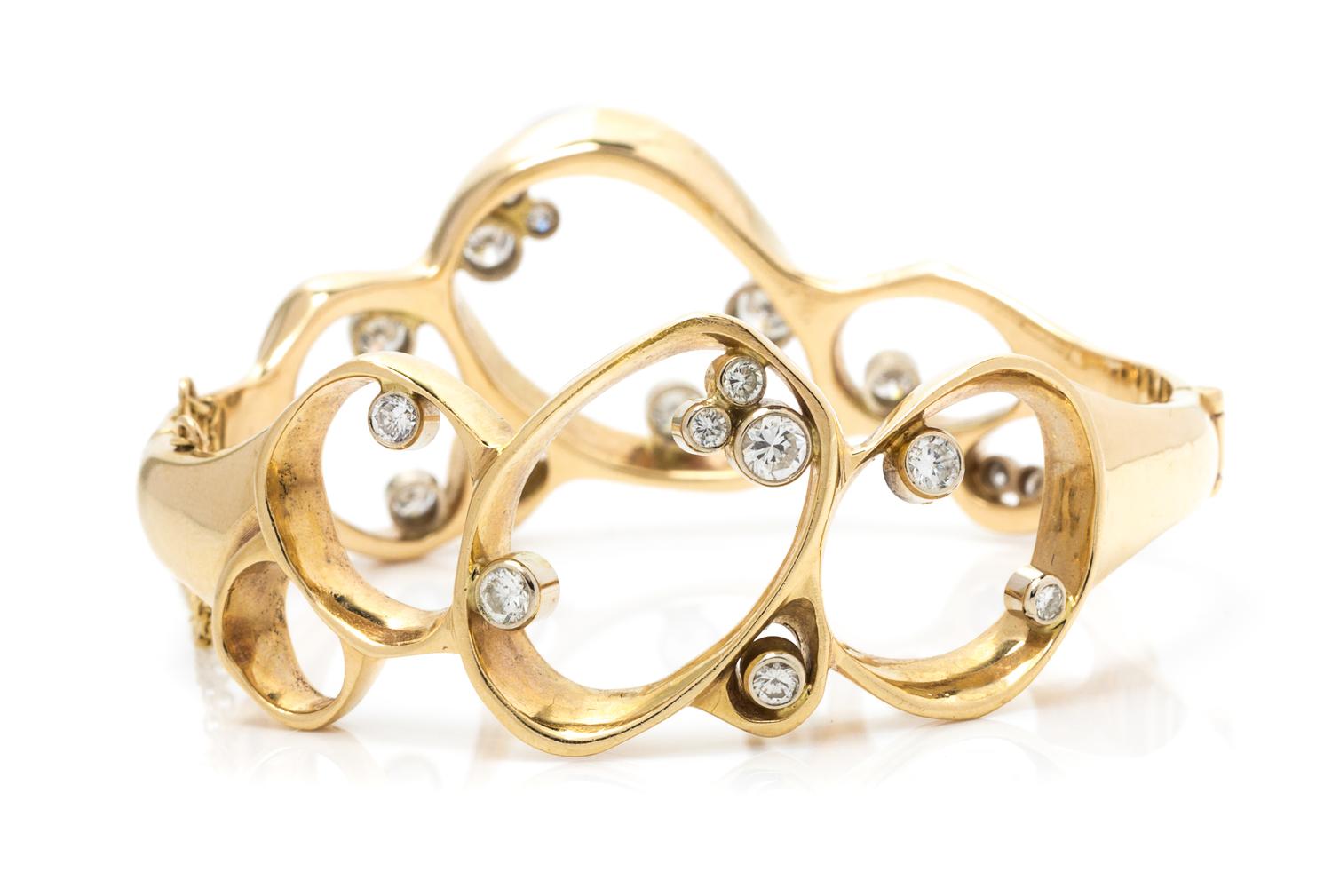 A Yellow Gold and Diamond Bangle Bracelet, 29.20 dwts.