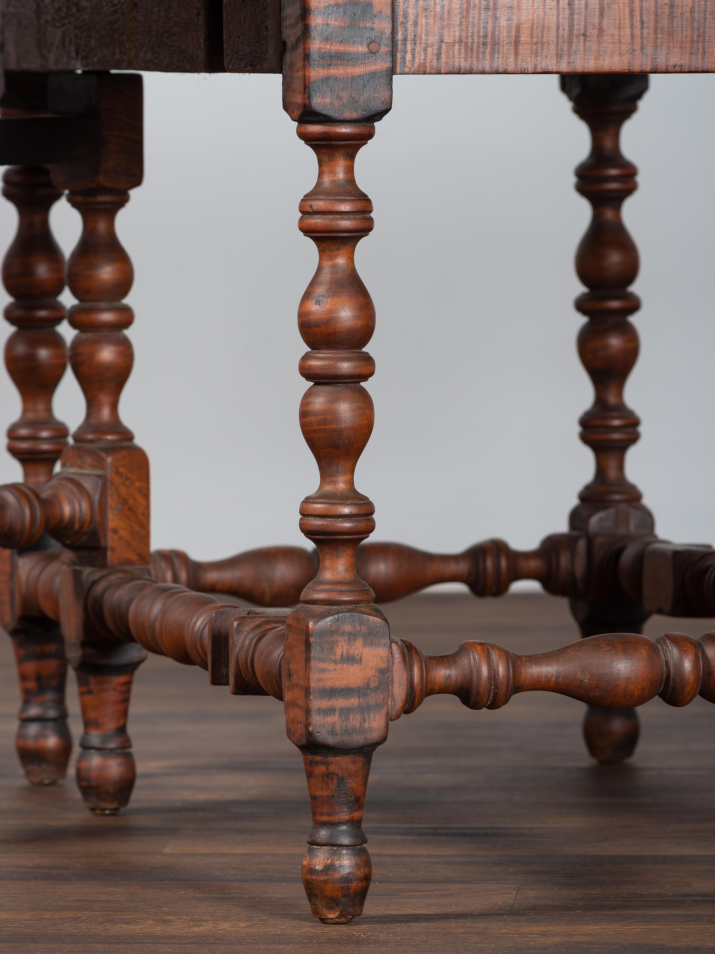 A William and Mary Figured Maple Drop Leaf Dining Table