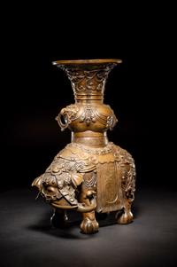 An Embellished Bronze Figure of an Elephant and Vase