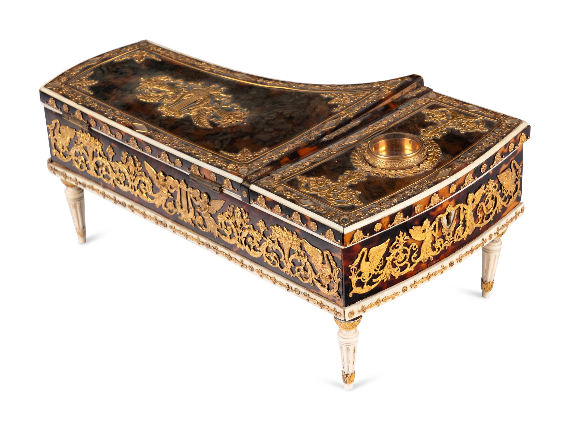 A Palais Royal Gilt Metal Mounted Tortoise Shell Piano Form Nécessaire Case