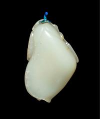 A Chinese Russet and White Jade ‘Magnolia’ Snuff Bottle