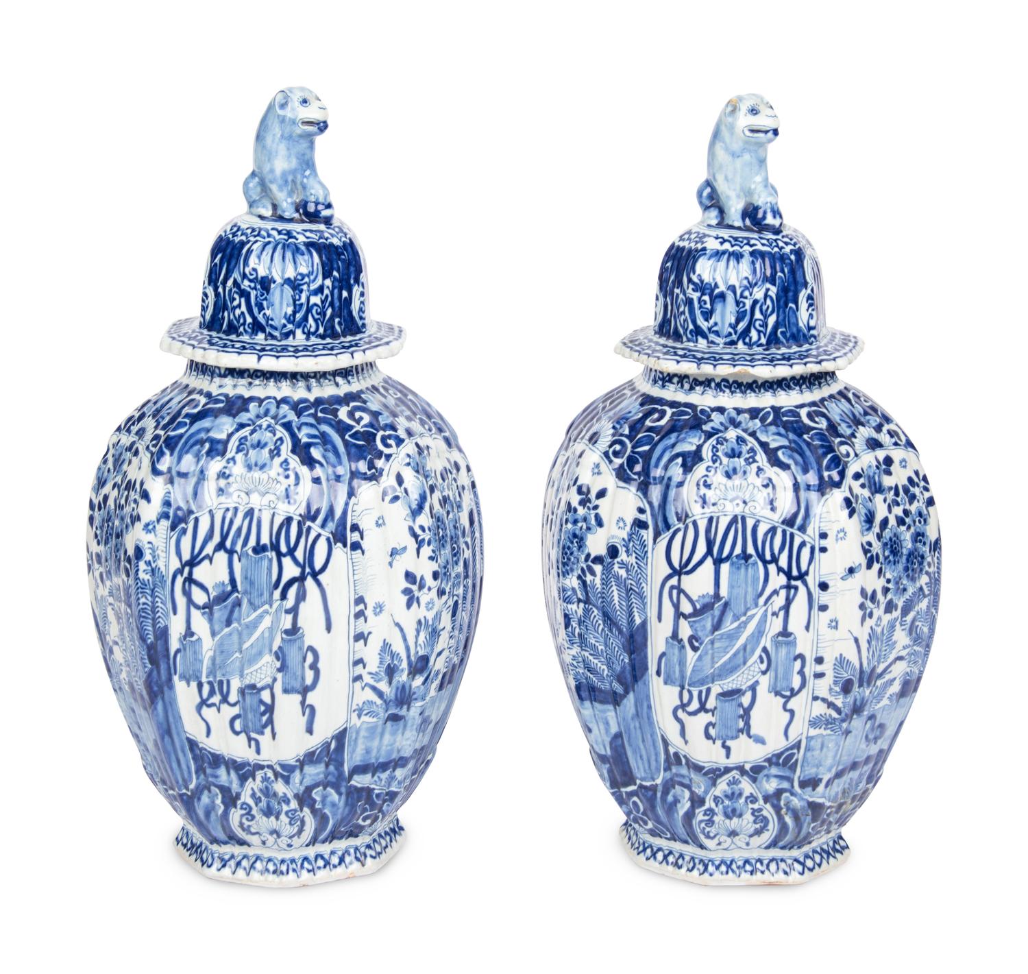 A Pair of Delft Blue and White Covered Jars